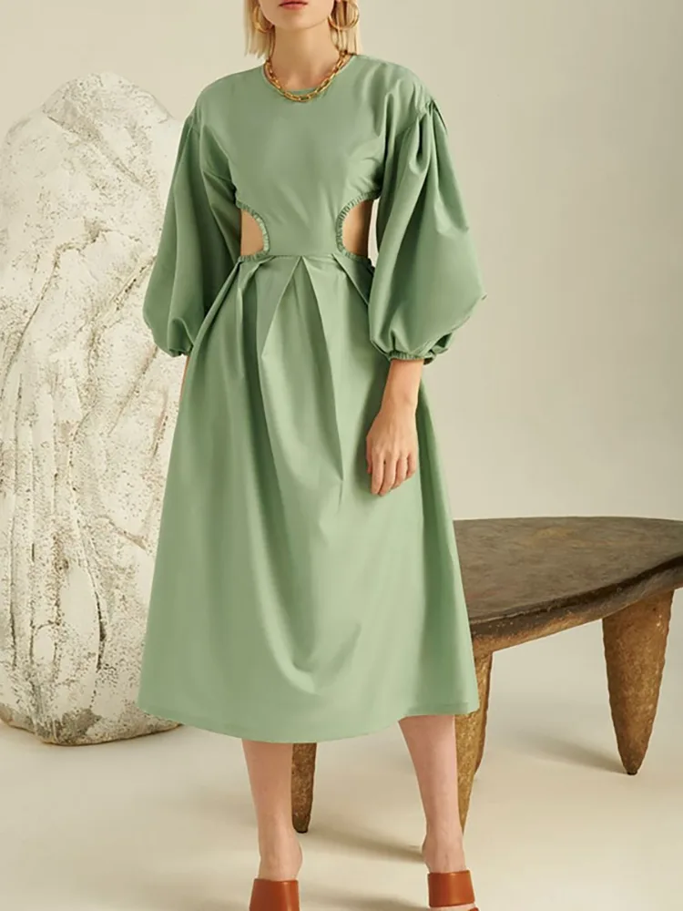 Apa yang membuat gaun linen lengan panjang ini terpisah dari yang lain?